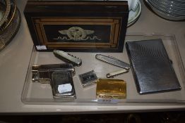 A selection of tobacco smokers items including inlayed eagle decorated humidor and lighters