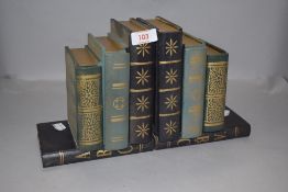 A pair of novelty bookends, formed as stacked books with 'secret' compartments