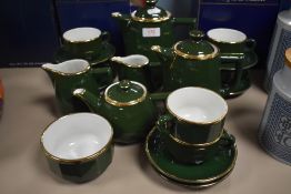 A French part coffee service in porcelain having green and gilt decoration