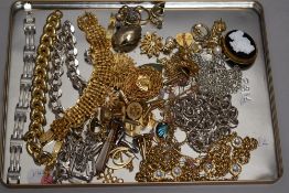 A selection of gold and silver plated costume jewellery including cufflinks, brooches, chains, dress