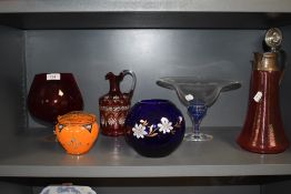 A selection of art glass including cranberry swirl claret jug and footed fruit bowl