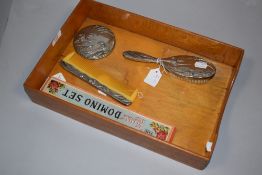 A polished metal dressing table set along with Dominoes and letter rack