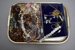 A small selection of costume jewellery including necklaces, two wrist watches, earrings, rings etc