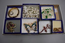 A small selection of 1990's costume jewellery in Cabouchon boxes including enamelled bangle,
