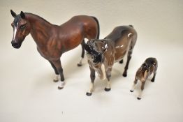 A Beswick Mare 976 in brown gloss, Foal 1816 in brown gloss, a Goebel horse