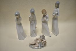 A collection of Nao and similarly styled figurines.