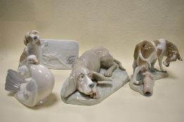 A cow and pig figure base by Lladro with similar porcelain plaque also two Nao dog figures and a
