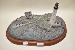 A model diorama base of Boston light house bearing a pre production label in a Lilliput Lane style