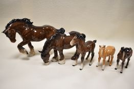 Two Beswick Shire horses; Spirit of Faith 2914, Grazing shire 1050 and two small shire foals 1053 (