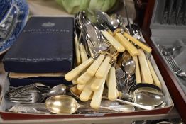 A good selection of cutlery and table wares including butter knives and serving set