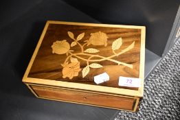 An inlaid wooden box having rose design to lid and lined in pink fabric,around 1970s.