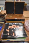 A mid century Stereosound system 404 with speakers and a selection vinyl