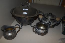 An early 20th century silver plated soup tureen with liner, tea pot, sugar and creamer.