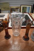 A large clear cut crystal vase in a Bohemian design and a pair of iridescent glass vase