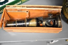 An early 20th century 'The college microscope' in box.