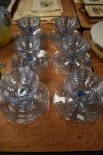A set of six sundae dishes in a blue ribbed glass design