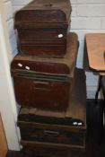 Three graduated metal tin trunks