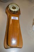 A small Edwardian shoe brush barometer having enamel face dial