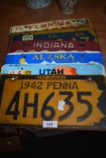 A set of six American license or car number plates
