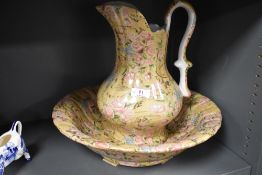 A Portuguese bird and blossom decorated baluster vase, a similar water jug, reproduction toilet