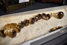 A vintage gold tone costume jewellery set comprising of bracelet,pendant and ring,marked Korea.