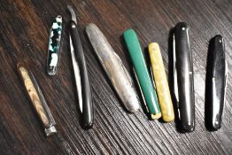 An assortment of antique pen knives, various compositions and colours.