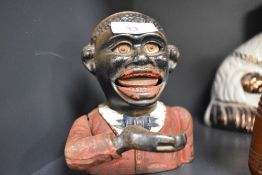 A vintage mechanical ' little Joe bank'.