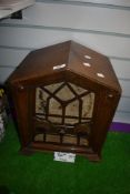 An oak cased art deco era tube radio having a gothic style case