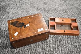 A rose wood veneered writing box having MOP inlaid details and escutcheon with compartmental