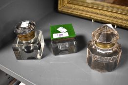 A group of three 19th/20th century glass inkwells, each of good size and weight.
