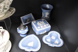 Six items of Wedgwood, to include desk top lighter, vase and trinket dishes.