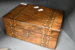 An early 20th century marquetry jewellery box having key and internal tray.