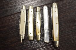 A group of Five early 20th century Mother-of-Pearl mounted and steel bladed pocket knives.