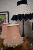 Two brass based table or bed side lights and similar glass stem lamp