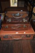A set of four graduated leather bound suitcases ideal for display