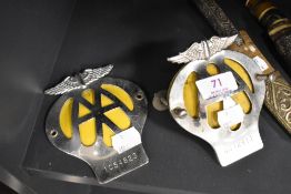 Two AA Membership grill badges, Numbers 6C72911 and 1C54823.