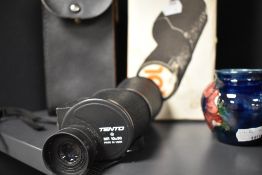 A Tento 10X prism monocular telescope.
