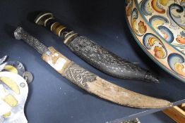 Two Indo-Persian Khanjars, circa 19th century,both having inlaid detailing,AF.