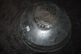 A vintage chromed motor car hub cap for Packard