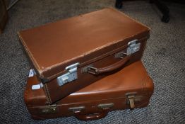 Two vintage leather bound suitcases of small size