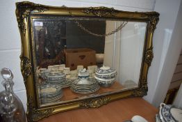 A vintage style gilt and gesso bevel edged mirror