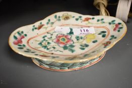 A Chinese famille rose porcelain shallow dish, of shaped oval form decorated with blossoms and