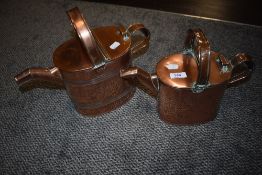 Two Victorian copper hot water cans.