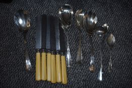 An uncased set of six 'Goldsmiths & Silversmiths Company' steel bladed knives, mixed white metal