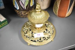 A Victorian brass ink well having lead liner and ornate styling.AF.