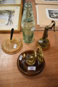 A nautical theme nut cracker with a water well model and glass bottle