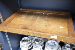 A 20th century oak tray having A.A.K.G carved to side.