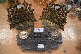 A novelty desk top ink well having a model of the Cathedrale De Reims with two brass letter racks