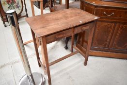A mahogany and oak side table, in the Arts and Crafts or Shaker style