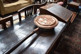 A traditional copper bed warming pan